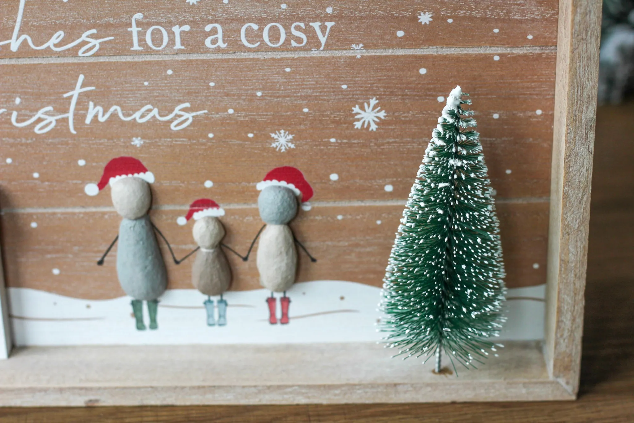 Large Festive Scene Wooden Framed Pebble People Plaque With Bottle Brush Tree